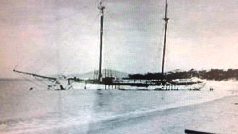 Old black and white photo of the Annie Taylor shipwreck at Rheban Beach.